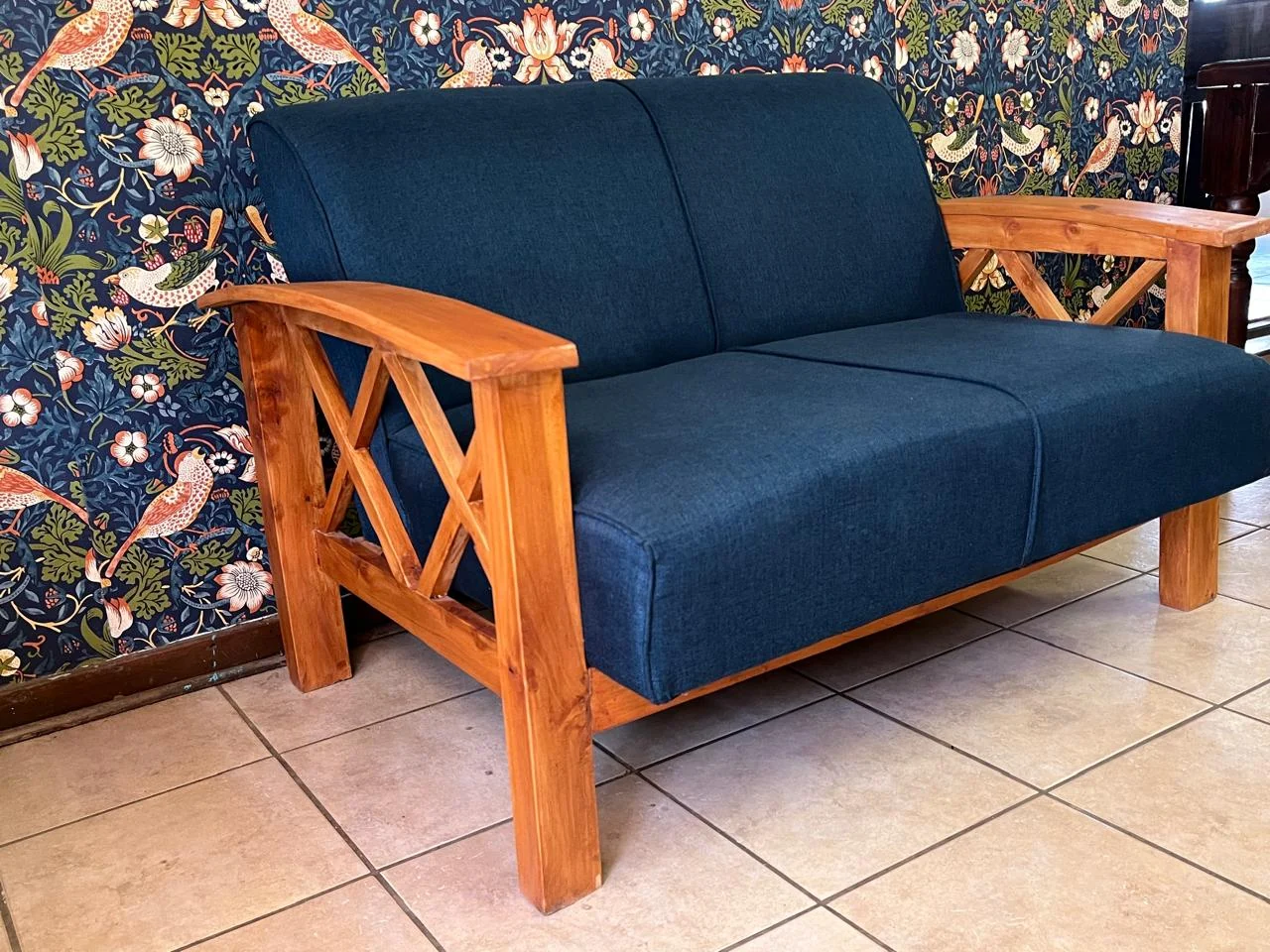 Blue custom-made sofa with solid wood arms